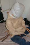 Fur-lined sheepskin and tan leather strait-jacket